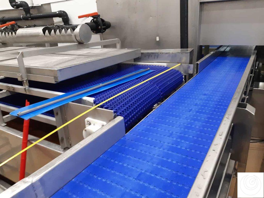 Sistema de trasvase entre cintas transportadoras industriales